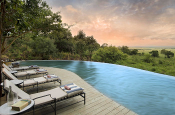 Enjoy views of the Masai Mara plains from the pool at Bateleur Camp