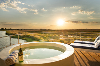 Enjoy a sundowner from the pool on the deck of the Chobe Princess