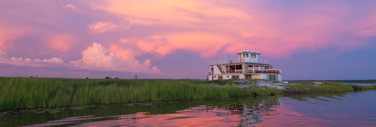 The Chobe Princess moored against the vibrant sunset