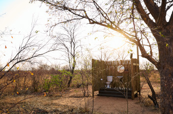 Open air bathrooms with views of the surrounding bush