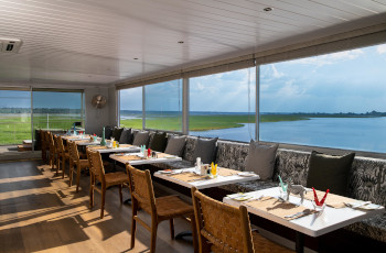 Dine on the Zambezi Queen overlooking the Chobe River