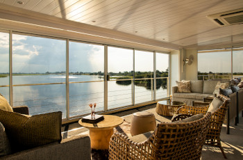 The lounge area on the Zambezi Queen, beautiful views out over the river
